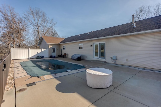 view of pool featuring a patio, a fenced backyard, and a fenced in pool