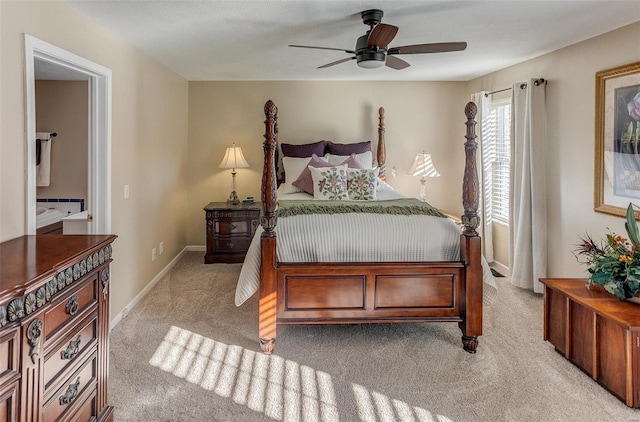 bedroom with light colored carpet, baseboards, and ceiling fan