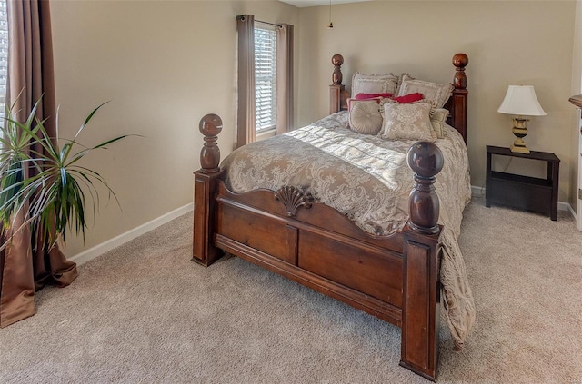 bedroom featuring carpet flooring and baseboards