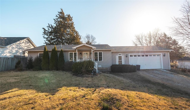 single story home with a front yard, fence, a garage, and dirt driveway