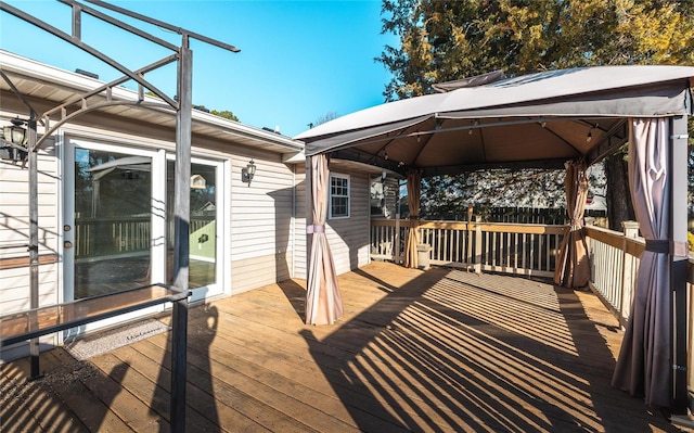 wooden terrace with a gazebo