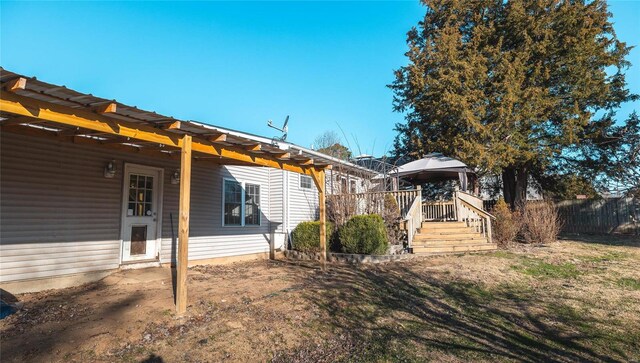 exterior space with a wooden deck and fence