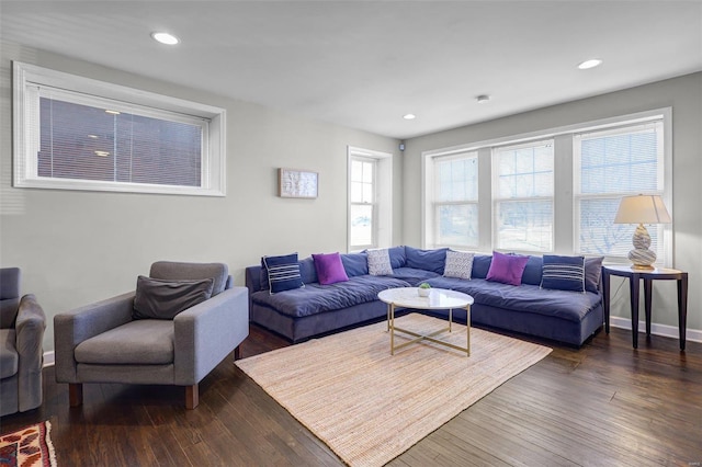 living room featuring recessed lighting and dark wood-style floors