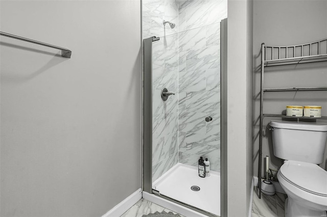 full bathroom featuring toilet, marble finish floor, and a shower stall