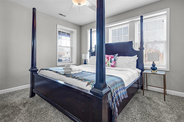 bedroom featuring visible vents, carpet flooring, baseboards, and ceiling fan