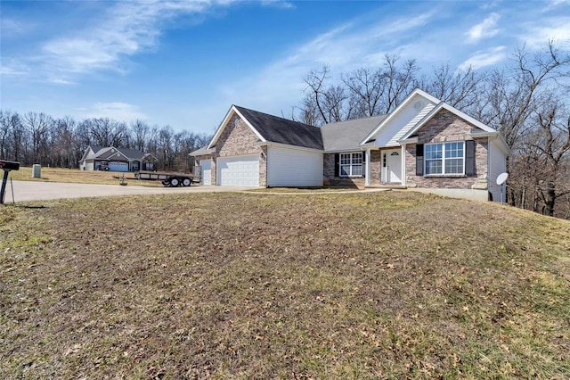 single story home with concrete driveway, a garage, and a front yard