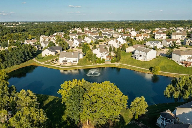 drone / aerial view featuring a residential view and a water view