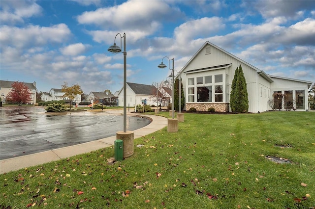 view of home's community with a yard and a residential view