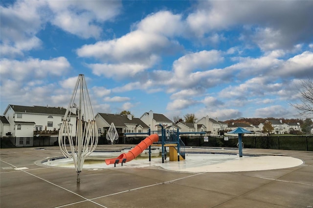 community jungle gym featuring a residential view and fence