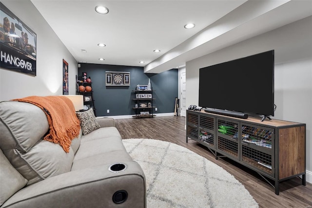 living room with recessed lighting, baseboards, and wood finished floors