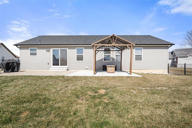 back of property featuring a gazebo, fence, a patio area, and a lawn