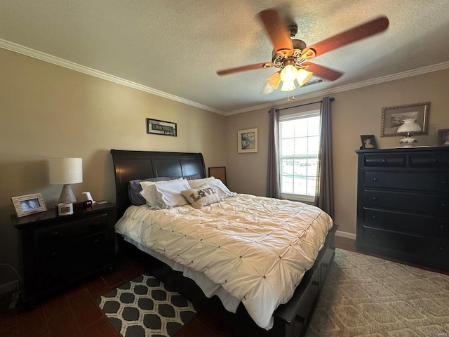 bedroom with visible vents, dark wood-type flooring, a ceiling fan, a textured ceiling, and crown molding