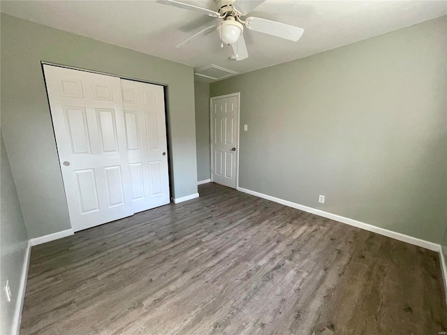 unfurnished bedroom with a closet, baseboards, wood finished floors, and a ceiling fan