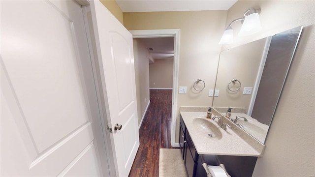 bathroom featuring vanity and wood finished floors