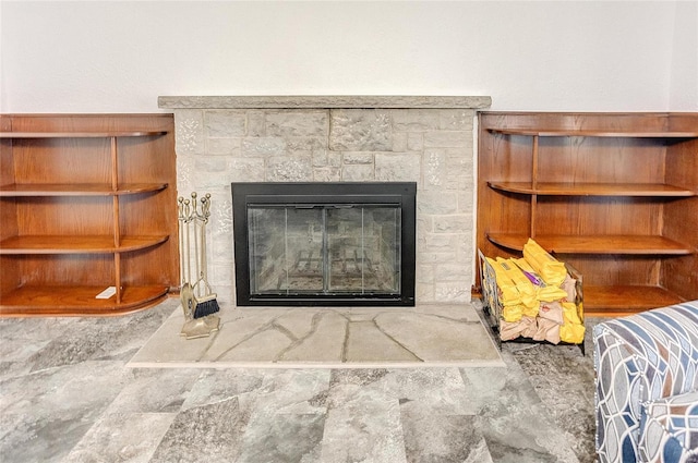 interior details featuring a glass covered fireplace