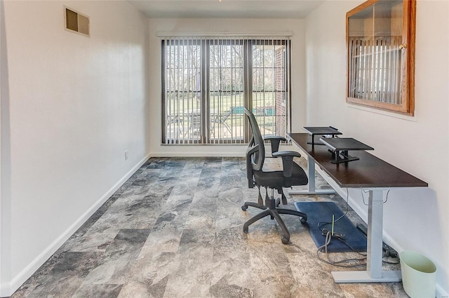 home office with visible vents and baseboards