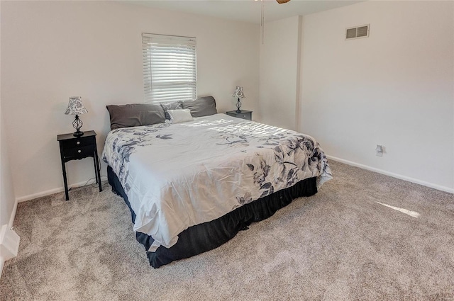 bedroom featuring carpet, visible vents, and baseboards