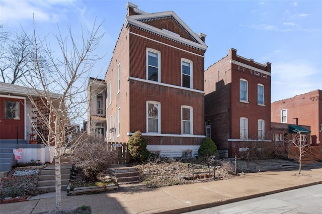 view of front facade featuring brick siding