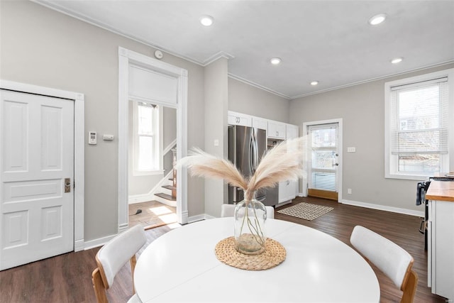 dining space featuring recessed lighting, dark wood finished floors, and ornamental molding