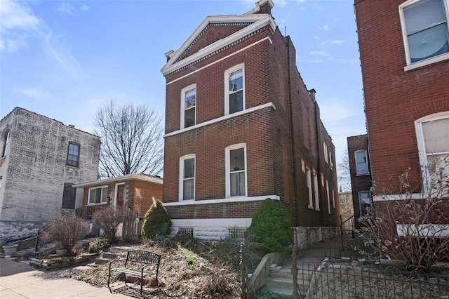 view of home's exterior with brick siding