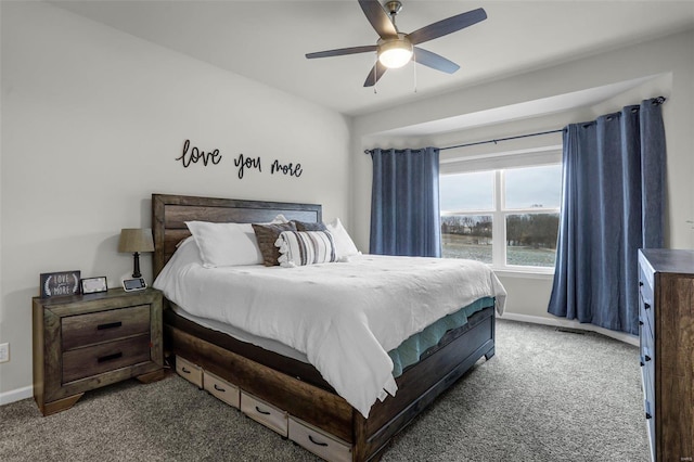 carpeted bedroom with a ceiling fan and baseboards