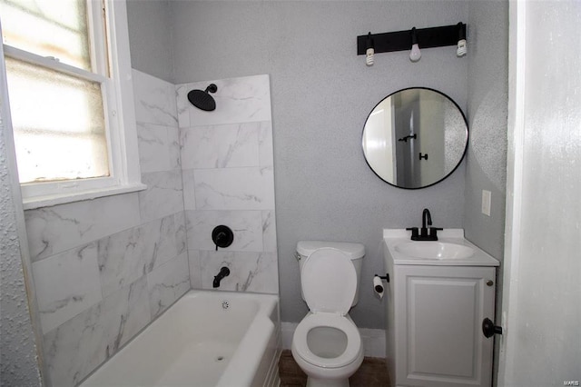 bathroom featuring toilet, bathtub / shower combination, and vanity