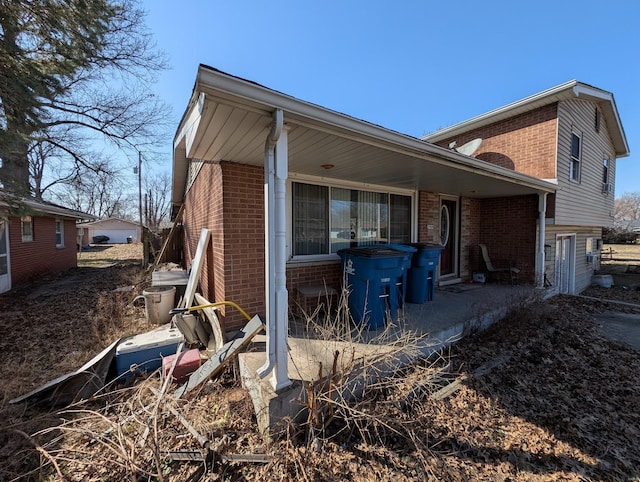 view of home's exterior with brick siding