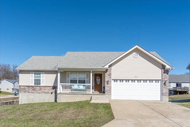 ranch-style home featuring driveway, a front lawn, covered porch, an attached garage, and brick siding