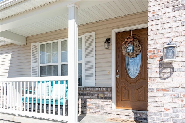 doorway to property with covered porch