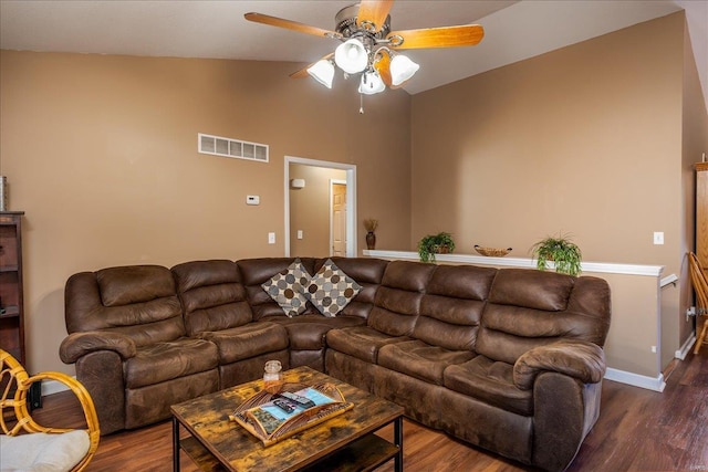 living room with visible vents, wood finished floors, ceiling fan, and vaulted ceiling