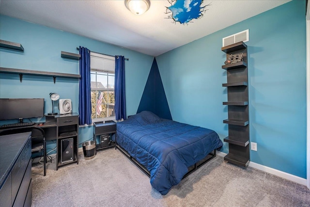 bedroom featuring visible vents, baseboards, and carpet floors