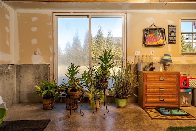 living area with concrete floors