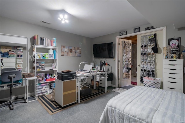 bedroom with visible vents and carpet