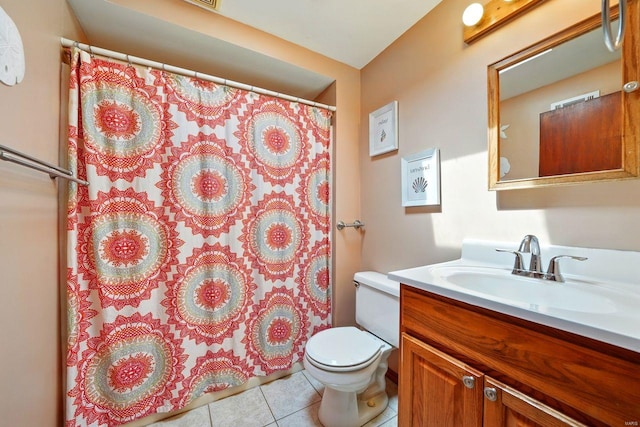 bathroom with toilet, vanity, a shower with curtain, and tile patterned floors