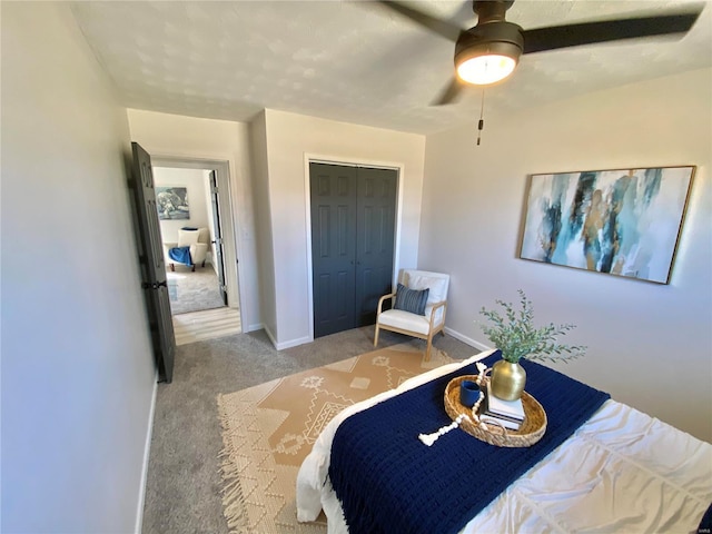 bedroom featuring a closet, baseboards, a ceiling fan, and carpet flooring