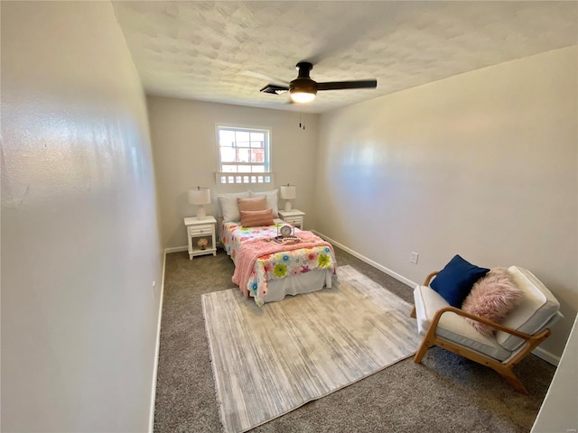 carpeted bedroom featuring ceiling fan, a textured ceiling, and baseboards