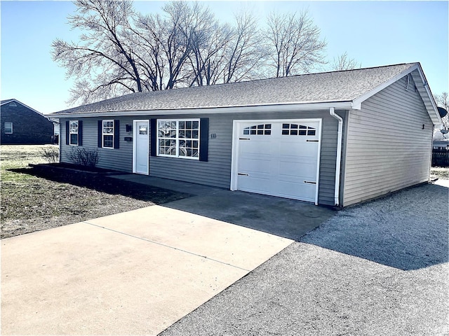 ranch-style home with an attached garage and concrete driveway