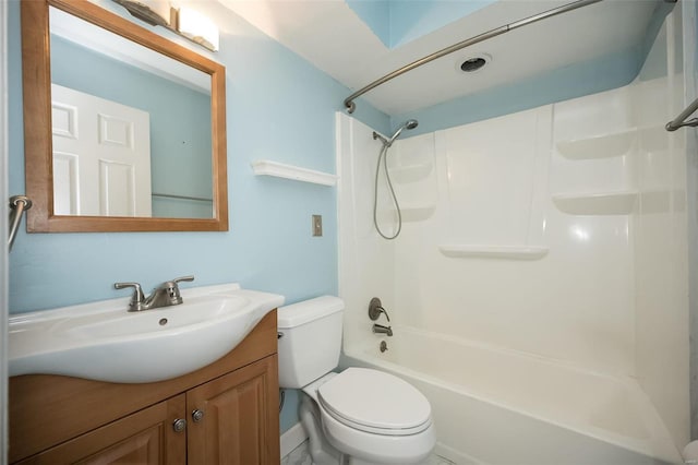 full bathroom featuring vanity, toilet, and washtub / shower combination