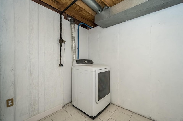 laundry room featuring washer / clothes dryer, light tile patterned flooring, and laundry area