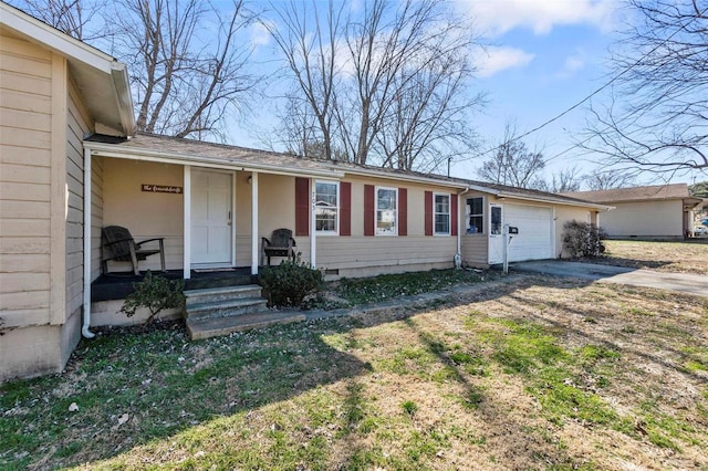 view of front of property with an attached garage and concrete driveway