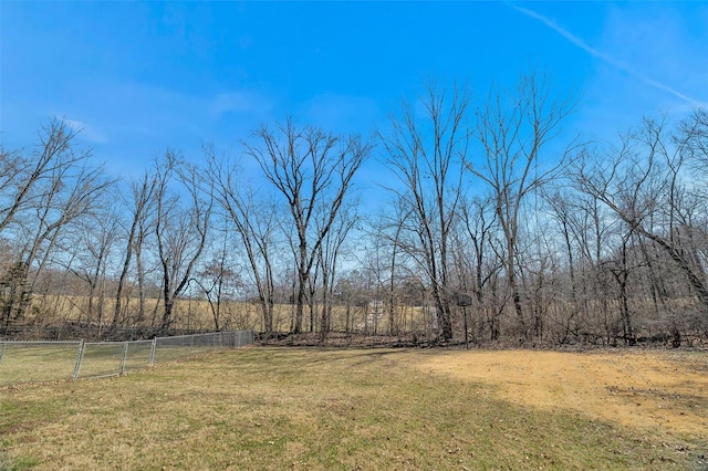 view of yard featuring a rural view and fence