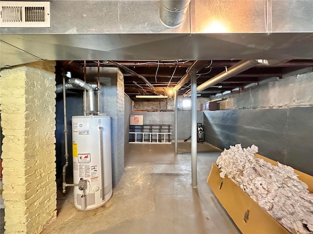 unfinished basement featuring visible vents and water heater