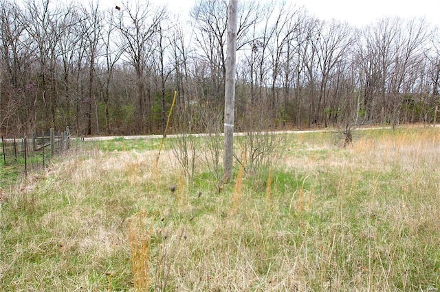 view of landscape with a forest view