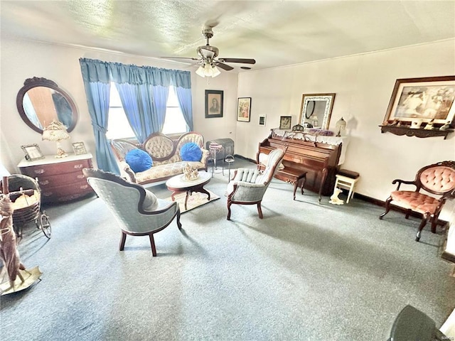 living room with baseboards, carpet, and a ceiling fan