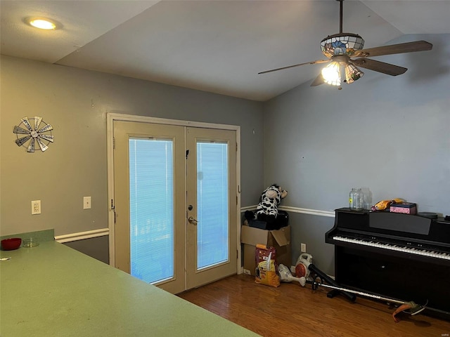 bedroom with french doors, wood finished floors, a ceiling fan, and vaulted ceiling