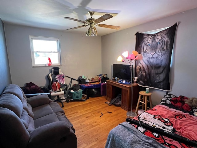 bedroom featuring a ceiling fan and wood finished floors