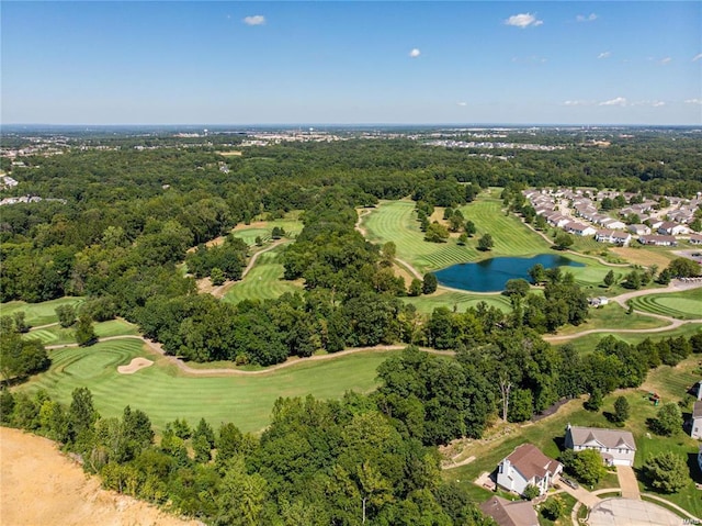 aerial view featuring view of golf course, a view of trees, and a water view