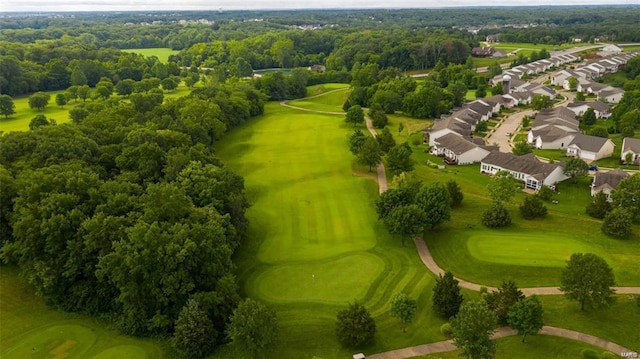 drone / aerial view featuring golf course view and a residential view