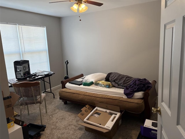 interior space with carpet flooring, baseboards, and ceiling fan