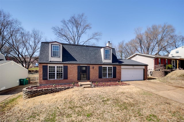 view of front of property with concrete driveway, a garage, brick siding, and a shingled roof